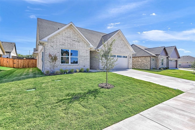 view of front of home featuring a garage and a front lawn