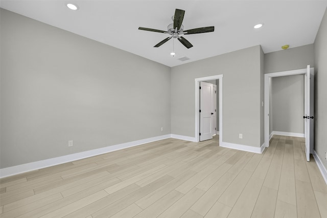 unfurnished bedroom featuring ceiling fan and light wood-type flooring