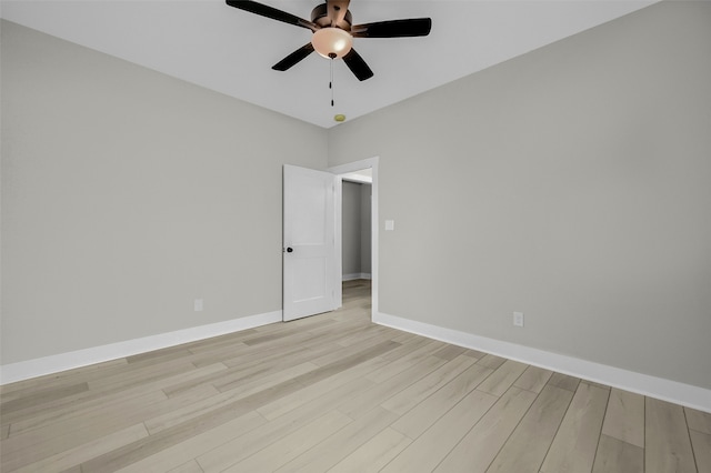 spare room with light hardwood / wood-style floors and ceiling fan