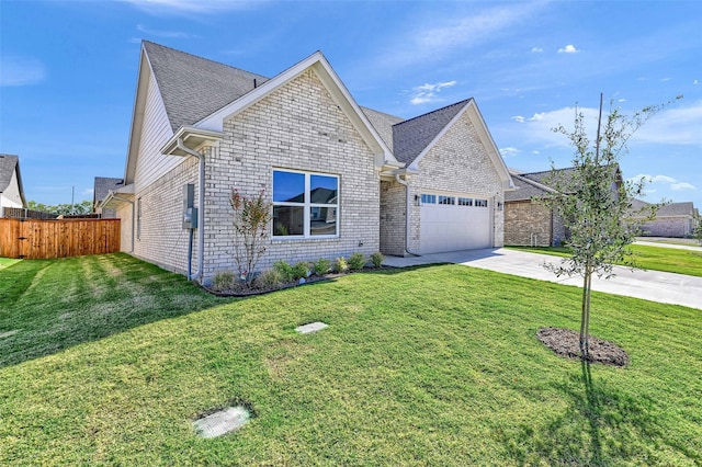 view of front of home featuring a garage and a front yard