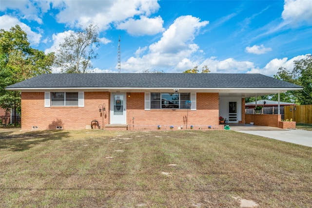 ranch-style house featuring a front lawn and a carport