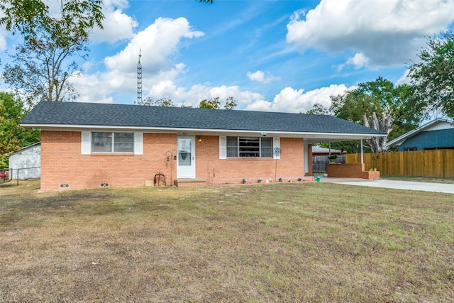 ranch-style home with a carport and a front yard