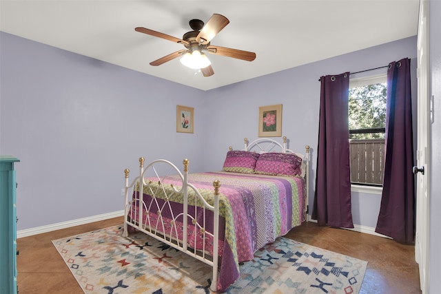 bedroom with tile patterned floors and ceiling fan