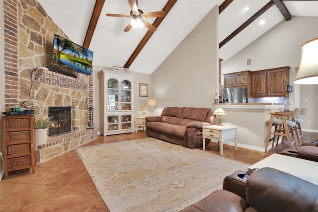 living room featuring ceiling fan, high vaulted ceiling, beamed ceiling, and a fireplace