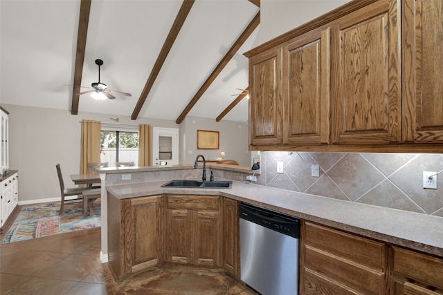 kitchen with stainless steel dishwasher, sink, vaulted ceiling with beams, and kitchen peninsula