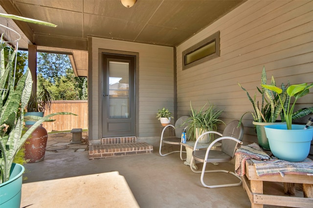 entrance to property featuring a patio