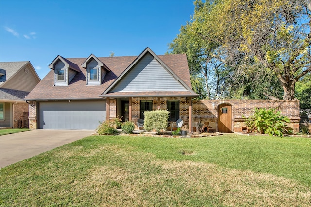 view of front of house with a front yard and a garage