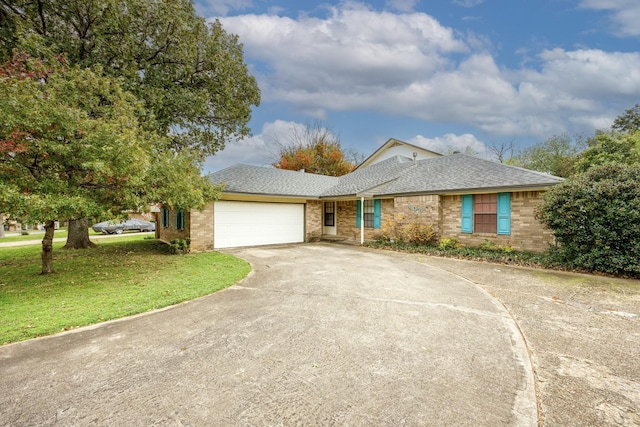 406 Rita Ln, Duncanville, TX 75116 - single story home with driveway, an attached garage, a front lawn, and brick siding