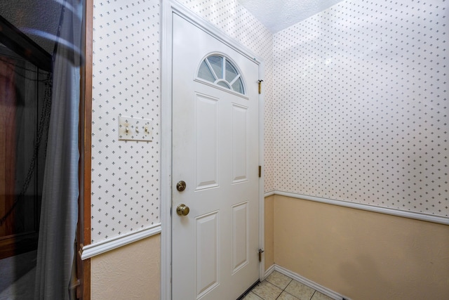 entryway featuring light tile patterned floors