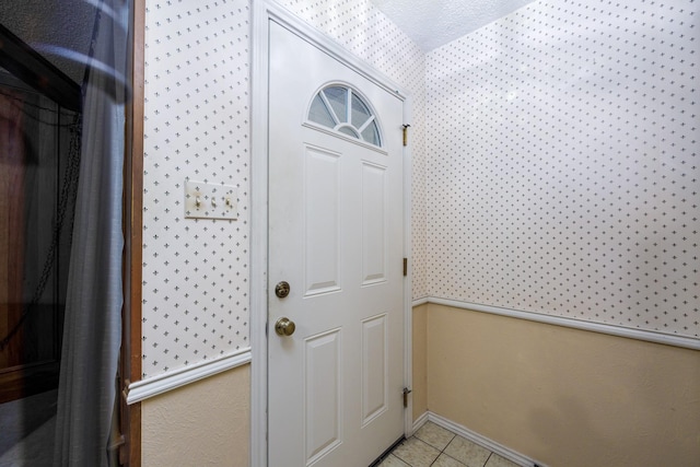 406 Rita Ln, Duncanville, TX 75116 - doorway to outside featuring wallpapered walls and light tile patterned flooring