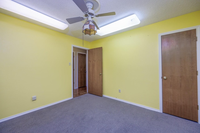 406 Rita Ln, Duncanville, TX 75116 - unfurnished bedroom featuring carpet, a textured ceiling, and a ceiling fan