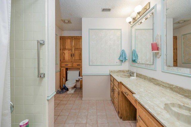 406 Rita Ln, Duncanville, TX 75116 - bathroom with a textured ceiling, double vanity, tile patterned floors, and curtained shower