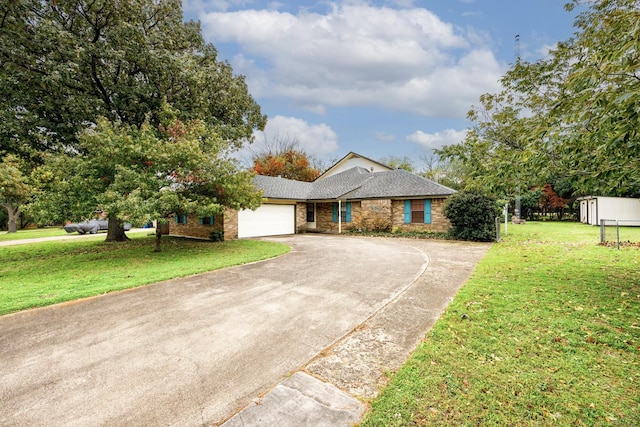 406 Rita Ln, Duncanville, TX 75116 - view of front of property featuring curved driveway, a garage, a front lawn, and brick siding
