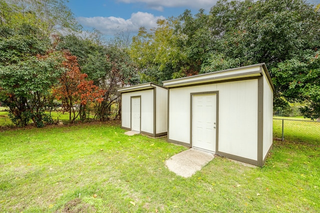 view of outdoor structure with a yard