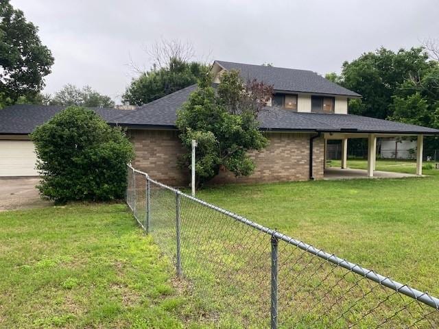 406 Rita Ln, Duncanville, TX 75116 - rear view of property featuring brick siding and roof with shingles