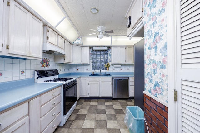 406 Rita Ln, Duncanville, TX 75116 - kitchen with stainless steel dishwasher, black gas range oven, ceiling fan, under cabinet range hood, and light countertops