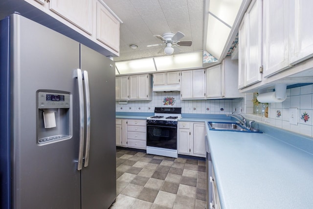 406 Rita Ln, Duncanville, TX 75116 - kitchen featuring stainless steel fridge with ice dispenser, white range with gas cooktop, a ceiling fan, light countertops, and backsplash