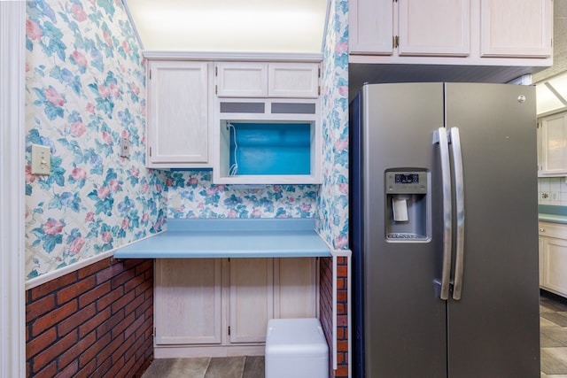 kitchen featuring stainless steel fridge