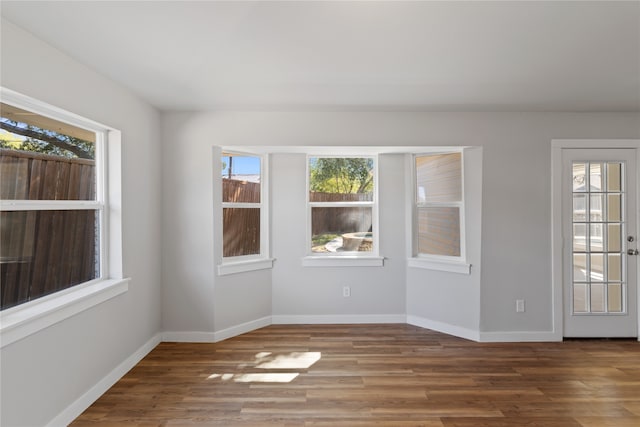 unfurnished room featuring hardwood / wood-style floors