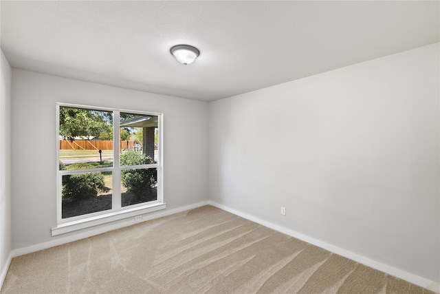 empty room featuring carpet flooring