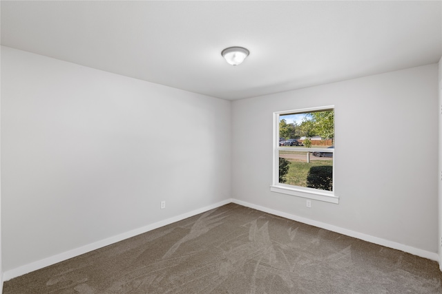 spare room featuring carpet