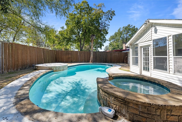 view of swimming pool featuring an in ground hot tub