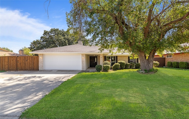 ranch-style house with a front lawn and a garage