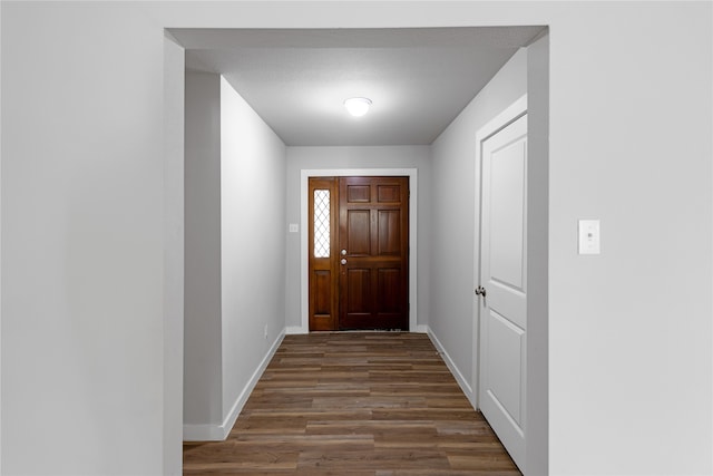 entryway with hardwood / wood-style flooring