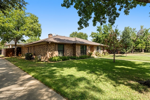 ranch-style home with a front lawn