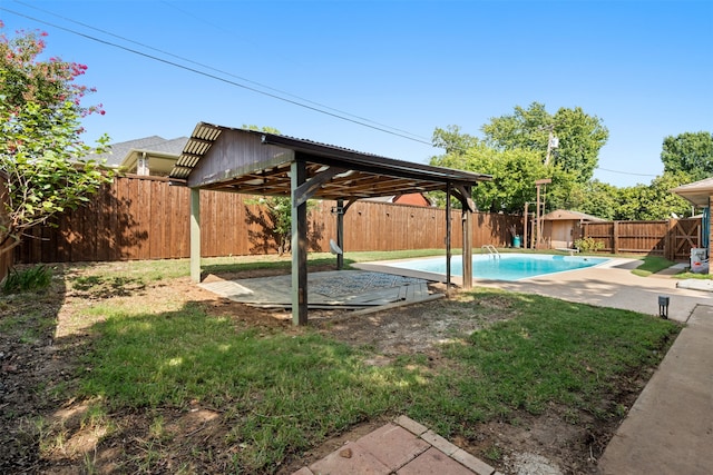 view of pool featuring a yard and a patio area