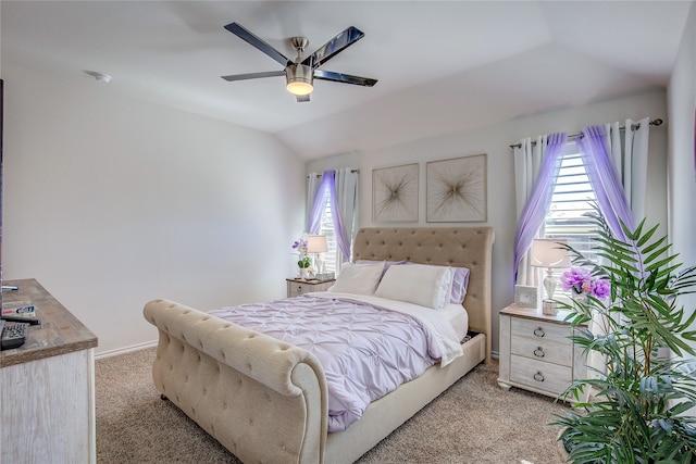 carpeted bedroom with lofted ceiling, multiple windows, and ceiling fan