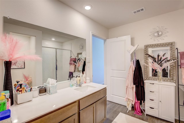 302 Patina St, Josephine, TX 75189 - bathroom featuring vanity, wood finished floors, a stall shower, and recessed lighting