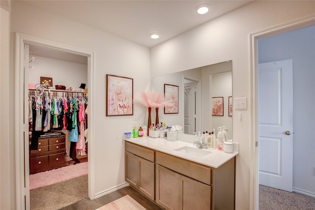 bathroom featuring vanity and hardwood / wood-style floors