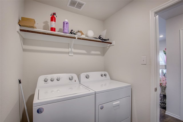 laundry room featuring washing machine and clothes dryer