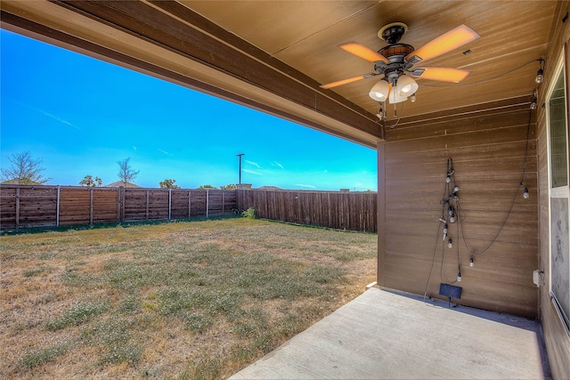 view of yard with a patio and ceiling fan