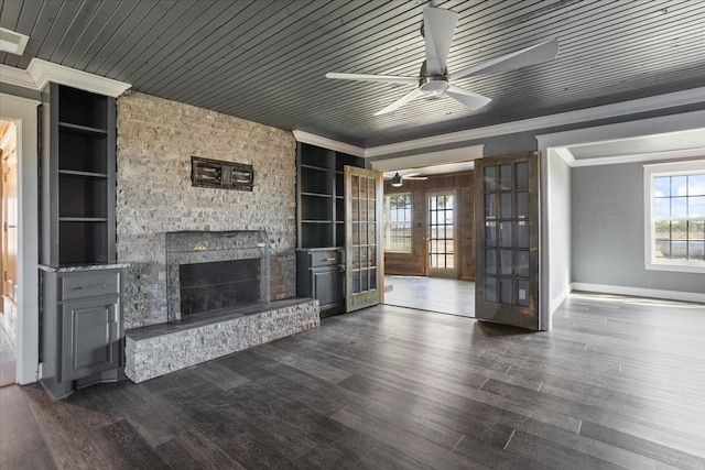 unfurnished living room with ornamental molding, french doors, dark hardwood / wood-style floors, and wooden ceiling