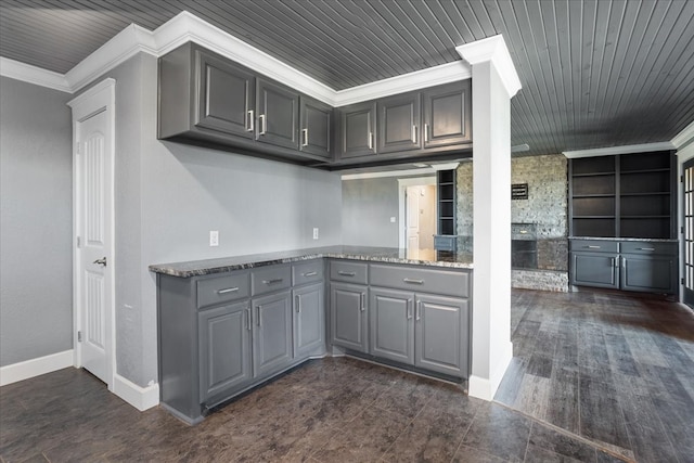 kitchen with crown molding, wood ceiling, gray cabinetry, and built in features