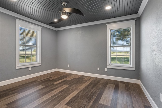 unfurnished room with ornamental molding, plenty of natural light, and dark hardwood / wood-style floors