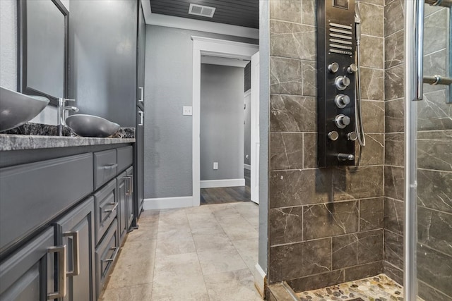 bathroom featuring vanity and a tile shower