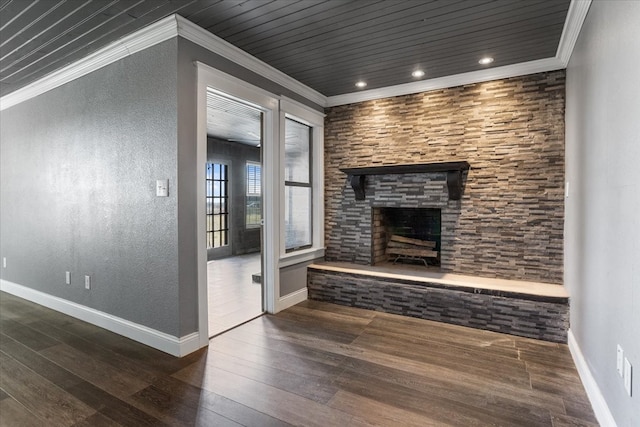 unfurnished living room featuring crown molding, a fireplace, dark hardwood / wood-style floors, and wood ceiling