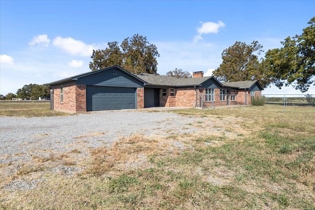 ranch-style house with a front lawn and a garage