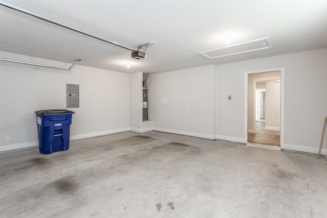 garage with a garage door opener, water heater, and electric panel