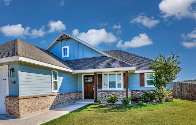 craftsman-style home with a front yard