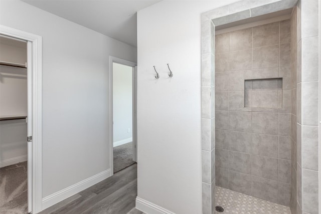 113 Bailey Ranch Dr, Lindsay, TX 76240 - full bathroom with tiled shower, wood finished floors, a spacious closet, and baseboards