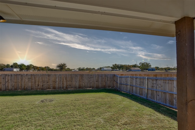 view of yard at dusk