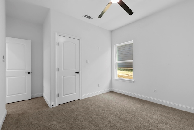 unfurnished bedroom featuring carpet and ceiling fan