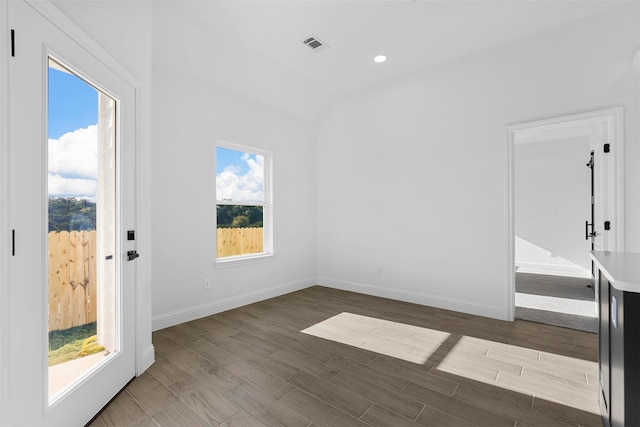 spare room featuring wood-type flooring