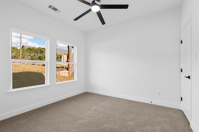 carpeted empty room featuring ceiling fan