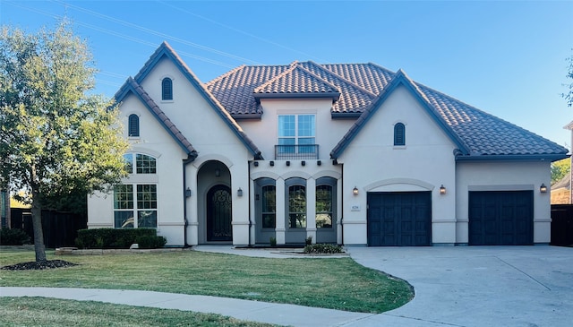 view of front of house featuring a front yard and a garage