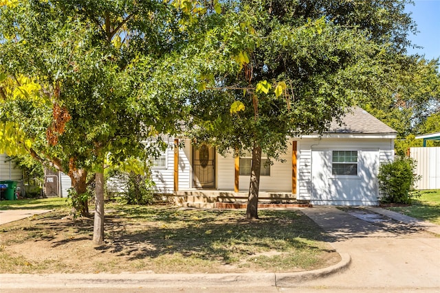 obstructed view of property featuring covered porch